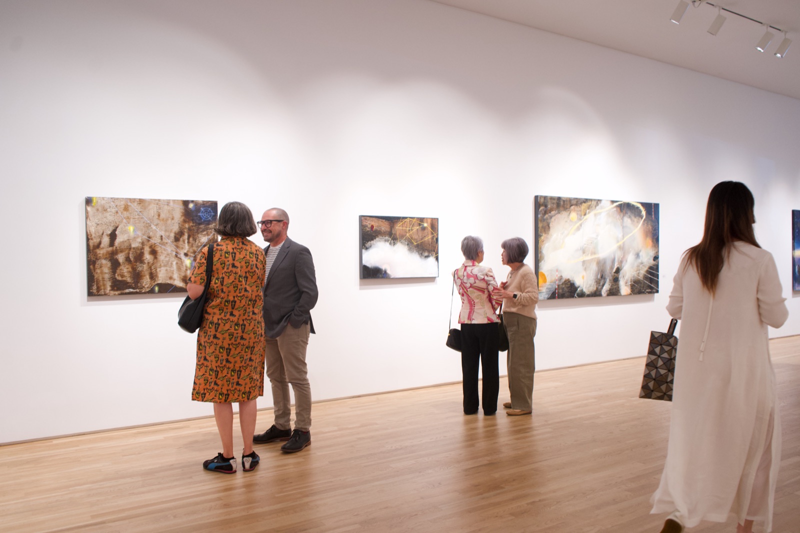 Exhibition opening — guests and gallery atmosphere
